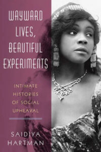 Portrayal of vintage elegance: a classic black and white photograph of a woman, capturing the essence of bygone grace adorned with intricate accessories, on the cover of 'wayward lives, beautiful experiments' by saidiya hartman.