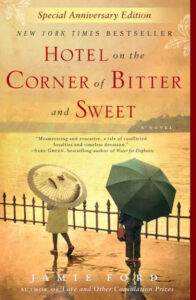 An evocative cover of jamie ford's novel, 'hotel on the corner of bitter and sweet,' conjuring the essence of historical fiction with asian influences, captured through the image of an individual holding a parasol amidst swirls of delicate design.