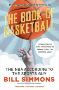 A hand reaching up to a basketball in motion, superimposed over the cover of "the book of basketball" by bill simmons, touted as a new york times bestseller with fresh takes on lebron, the nba, the celtics, and more.