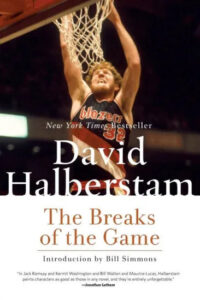 A basketball player in mid-air about to score, with the title "david halberstam the breaks of the game" and accolades for the book on the cover.