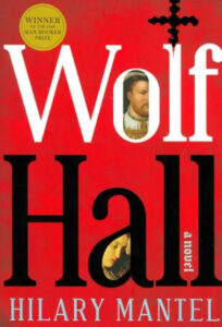 The cover of the novel "wolf hall" by hilary mantel, featuring large red text with the book title, a small portrait of a historical figure in a medallion, and an accolade as the winner of the man booker prize.
