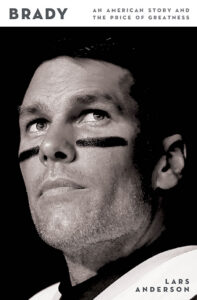 Black and white close-up of a football player with eye black, looking upward; book title reads "Brady.