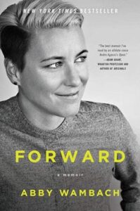 A woman with short, blonde hair smiling gently, featured on the cover of her memoir titled "forward.