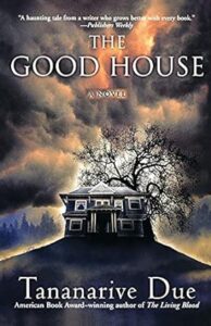 Cover of "the good house," a novel by tananarive due, featuring a silhouette of a large house with an ominous tree and a moody sky in the background.