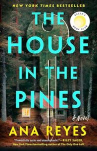 A cover of the novel "the house in the pines" surrounded by dark, dense pine trees, hinting at mystery and suspense within its pages.
