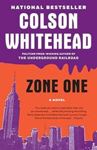 An illustration of a city skyline with an emphasis on a tall skyscraper is featured on the book cover of "zone one," a novel by the pulitzer prize-winning author colson whitehead, acclaimed for its depiction of a post-apocalyptic world intertwined with zombies, recognized as one of the best books of the year.