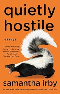 A book cover featuring a skunk with the title "quietly hostile" in bold letters, indicating a collection of essays by samantha irby, acclaimed for her humor and wit.