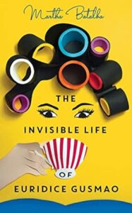 A vibrant book cover showcasing a hand holding a stripy cup from which emerges a cascade of black rolls or rings in various sizes, some enclosing vividly colored interiors, against a bright yellow background. the title "the invisible life of euridice gusmao" by martha batalha is prominently displayed at the top.