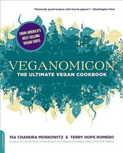 A vibrant cover of "veganomicon: the ultimate vegan cookbook" by isa chandra moskowitz & terry hope romero, featuring a lush garden of vegetables and plants, hinting at the plant-based recipes within.