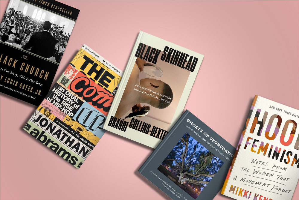 A varied collection of books splayed out, each cover suggesting diverse and thought-provoking topics from race and society to feminism and personal narratives.