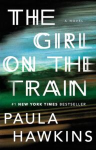 The cover of 'the girl on the train,' a gripping novel by paula hawkins, portraying a sense of motion and mystery reminiscent of a passing train's blurred view.