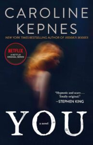 A promotional book cover featuring a blurred image of a woman with the title "you" in bold letters, highlighting that it's a novel by caroline kepnes, a new york times bestselling author, and the basis for a netflix original series, with a quote from stephen king describing it as "hypnotic and scary... totally original.