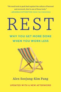 A bright yellow book cover for "rest: why you get more done when you work less" by alex soojung-kim pang, featuring a quote from arianna huffington and an illustrative image of a colorful striped deck chair, symbolizing relaxation and the theme of the book.