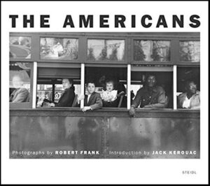 A glimpse through time: passengers from different walks of life share a moment within the close quarters of a public bus, immortalized in a black and white photograph.