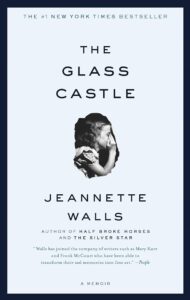 A book cover design for "the glass castle" by jeannette walls, touted as a memoir and a #1 new york times bestseller, with accolades from 'people' and frank mccourt featured at the bottom. the title is overlaid on a monochrome photographic silhouette of a woman's profile.