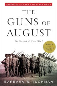 A line of soldiers from the early 20th century marching with their rifles at the ready on the cover of barbara w. tuchman's book "the guns of august," noted as a part of the great war series and a winner of the pulitzer prize.