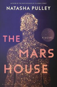 A silhouette of a person made up of glowing golden lights, standing against a dark background, overlaid with the text "natasha pulley - the watchmaker of filigree street - the mars house - a novel - bloomsbury".
