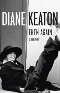 A monochromatic book cover showing a woman casually reclined against a wall, donning a wide-brimmed hat and tailored clothing, with the title "diane keaton then again a memoir" prominently displayed.
