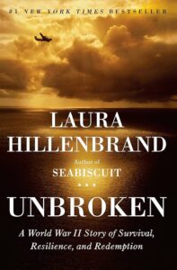 A lone vintage aircraft soars over a vast ocean bathed in the warm golden hues of a setting or rising sun, conveying a sense of solitude and endurance against a backdrop of majestic natural beauty, as featured on the cover of laura hillenbrand's "unbroken," a renowned world war ii narrative of survival and redemption.