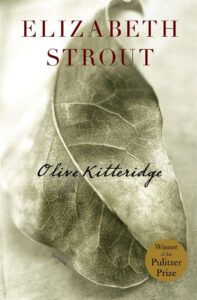 A book cover for "olive kitteridge" by elizabeth strout, highlighting a single, detailed leaf against a sepia-toned background, with an emblem indicating the book is a pulitzer prize winner.