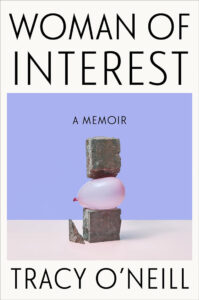 Book cover of "woman of interest" by tracy o'neill featuring an artistic stack of three stones with a pink balloon squeezed in the middle, set against a pastel blue background.