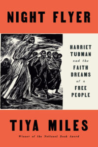 This is the cover of the book "night flyer: harriet tubman and the faith dreams of a free people" by tiya miles. it features a monochromatic illustration of harriet tubman guiding a group of people at night.