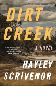 Book cover for "dirt creek" by hayley scrivenor. the title is in bold yellow text over an image of a dried-up, desolate creek with barren trees and a cloudy sky.