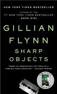 Book cover of "sharp objects" by gillian flynn, featuring large black and green text on a white background, with a mention of it being a new york times bestseller and adapted into a limited series.