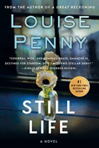 Book cover of "still life" by louise penny, featuring a translucent vase with a single flower set against a dark background, with praise and accolades prominently displayed.