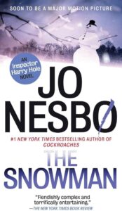 An advertisement for jo nesbø's novel "the snowman," featuring a graphic of a sinister-looking snowman and text indicating the book is soon to be adapted into a major motion picture, with critical acclaim from the new york times book review.