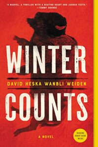 Book cover of "winter counts" by david heska wanbli weiden featuring bold white text against a red background, with an image of a bear in the center.
