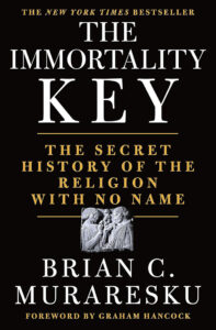 Cover of the book "The Immortality Key" by Brian C. Muraresku with a foreword by Graham Hancock. The subtitle reads, "The Secret History of the Religion with No Name." The cover also features an illustration of a sculpted relief of two figures.