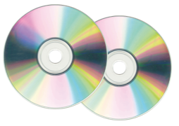 Two compact discs (CDs) with shiny, reflective surfaces are overlapping each other on a white background. The discs display a spectrum of colors due to the light reflection, creating a rainbow-like effect.