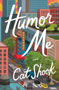 Colorful cityscape cover of "Humor Me: A Novel" by Cat Shook, featuring buildings, cars, and a comedy club sign.