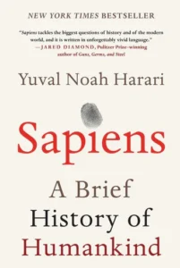 Cover of "Sapiens: A Brief History of Humankind" by Yuval Noah Harari featuring red and black text and fingerprint image.