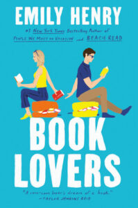 Cover of "Book Lovers" by Emily Henry, featuring a man and a woman reading back-to-back with a blue background.