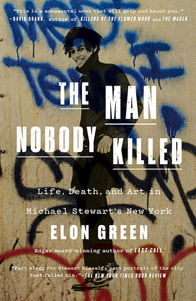 A smiling man stands against a wall covered in blue graffiti; book title text overlays the image.
