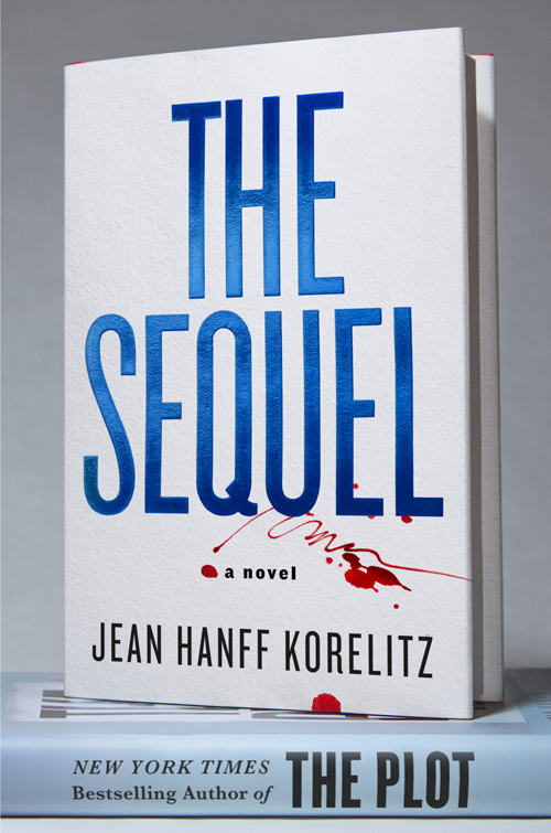 Book cover titled "The Sequel" by Jean Hanff Korelitz features large blue text and red ink splatters on a white background.