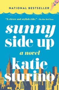 Book cover for "Sunny Side Up" by Katie Sturino, with a swimmer and city skyline on a bright blue background.