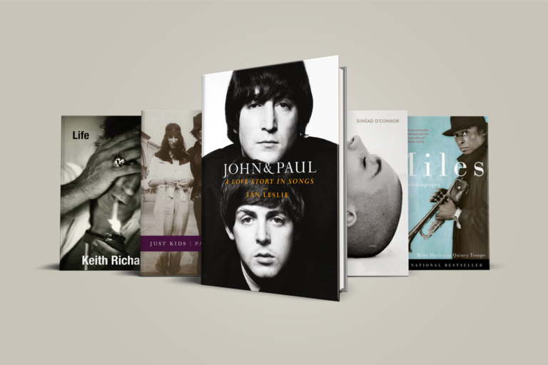 Five books displayed; centered is "John & Paul: A Love Story in Songs". Others include "Life" and "Just Kids".