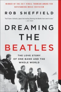 Cover of "Dreaming the Beatles" by Rob Sheffield, featuring a black-and-white photo of the band walking together.
