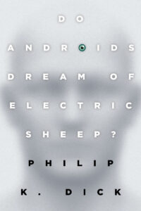 Book cover: "Do Androids Dream of Electric Sheep?" by Philip K. Dick, text over a blurred face, one "O" is an eye.