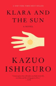Red book cover for "Klara and the Sun" by Kazuo Ishiguro, with a stylized hand and sun illustration.