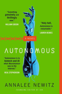 A robotic hand reaches upward on the cover of "Autonomous" by Annalee Newitz, with quotes from authors.