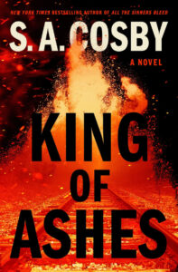 Book cover for "King of Ashes" by S.A. Cosby, featuring a fiery explosion over railroad tracks.
