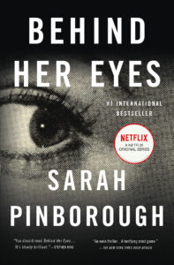 Book cover for "Behind Her Eyes" by Sarah Pinborough, featuring a close-up of a woman's eye.