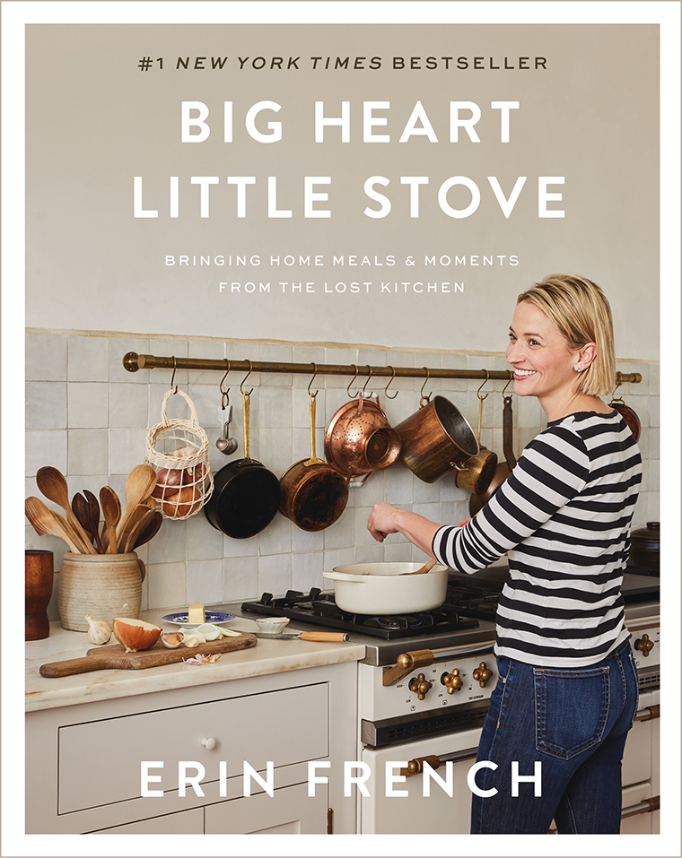 A woman cooking at a stove in a cozy kitchen, cover of "Big Heart Little Stove" by Erin French.
