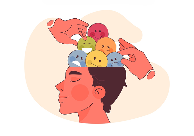 A person’s head open with hands arranging colorful faces showing different emotions inside.