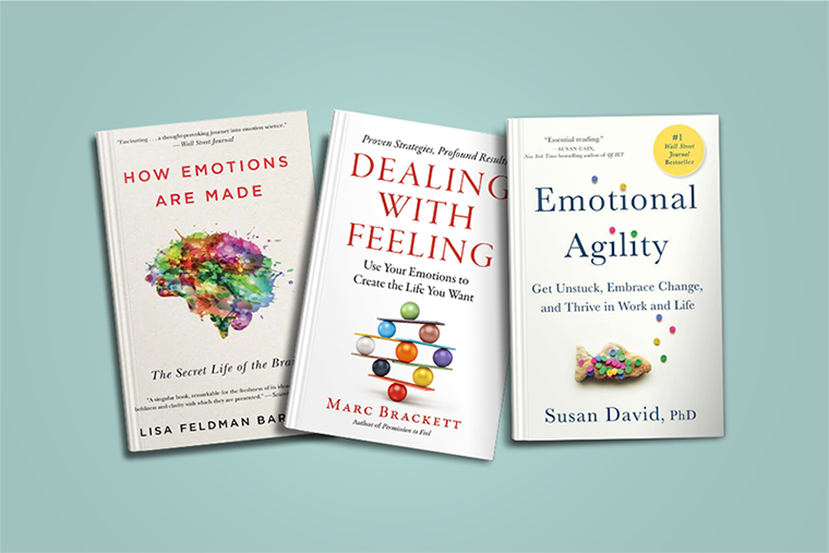 Three self-help books about emotions on a light blue background, arranged side by side and slightly angled.