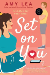 Illustrated woman in gym clothes looks at a man lifting a barbell; book title "Set on You" by Amy Lea.